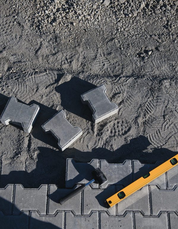 Laying paving stones. Paving tools for use.